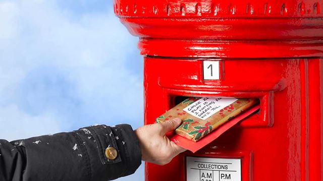 Christmas post hand posting mail
